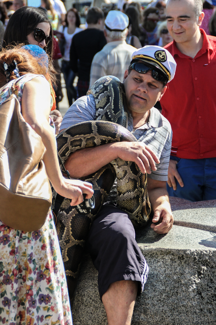 A Lithuanian sailor takes his snake out in public.