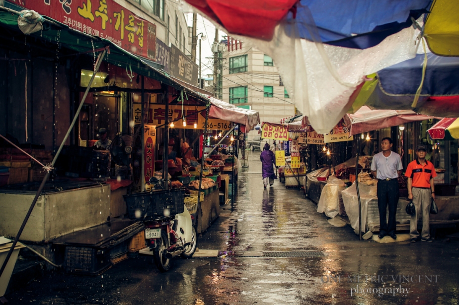 Rain comes down on the market in Suwon, Korea.