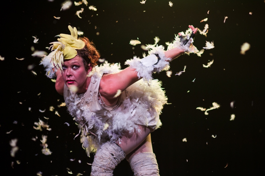 Bianca Mackail throws some feathers around. (c) 2014 all rights reserved